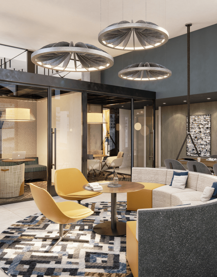 A modern office lobby & coworking space with a circular seating area. One of the top-notch amenities at Elle's DC apartments.