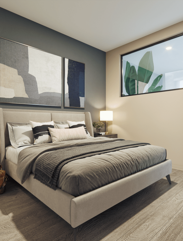 Luxury studio bedroom featuring a big bed & elegant wall paintings. A showcase of Elle's apartment's sleek design.