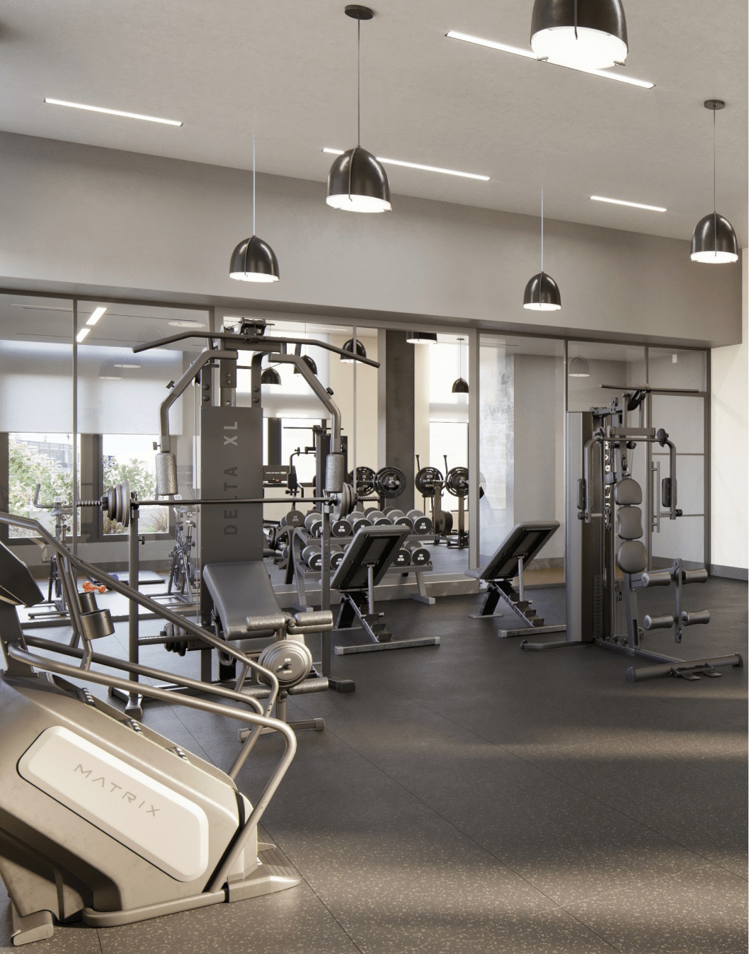 A gym room with exercise equipment & mirrors. One of the top-notch amenities at Elle's DC apartments.